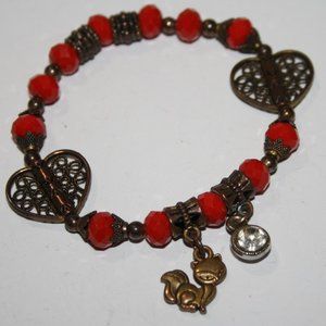 Beautiful red beaded bracelet with brass kitty charm 7"